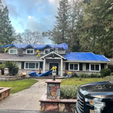 Crew tarping a home’s roof in Alamo, California after storm damage to prevent further water intrusion.